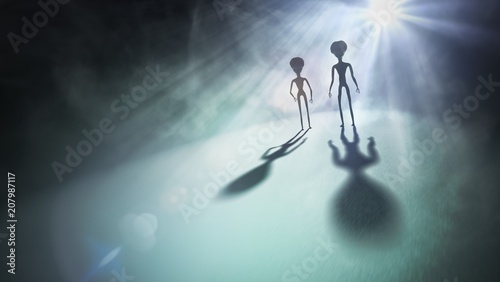 Obraz na płótnie Silhouettes of aliens and bright light in background