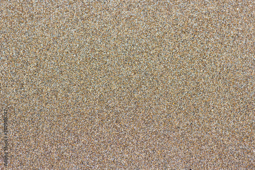 Sandy beach background. Detailed sand texture, top view Sandy beach background. Detailed sand texture, top view