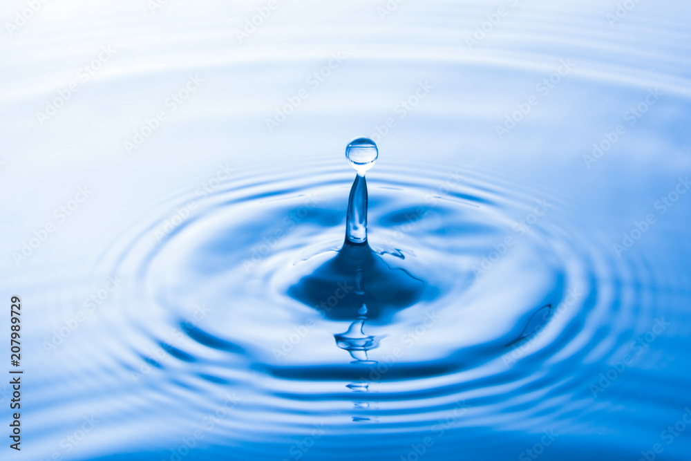 Water drop falling into water make waves. Water splash or water drop background. Water drop falling into water make waves. Water splash or water drop background.