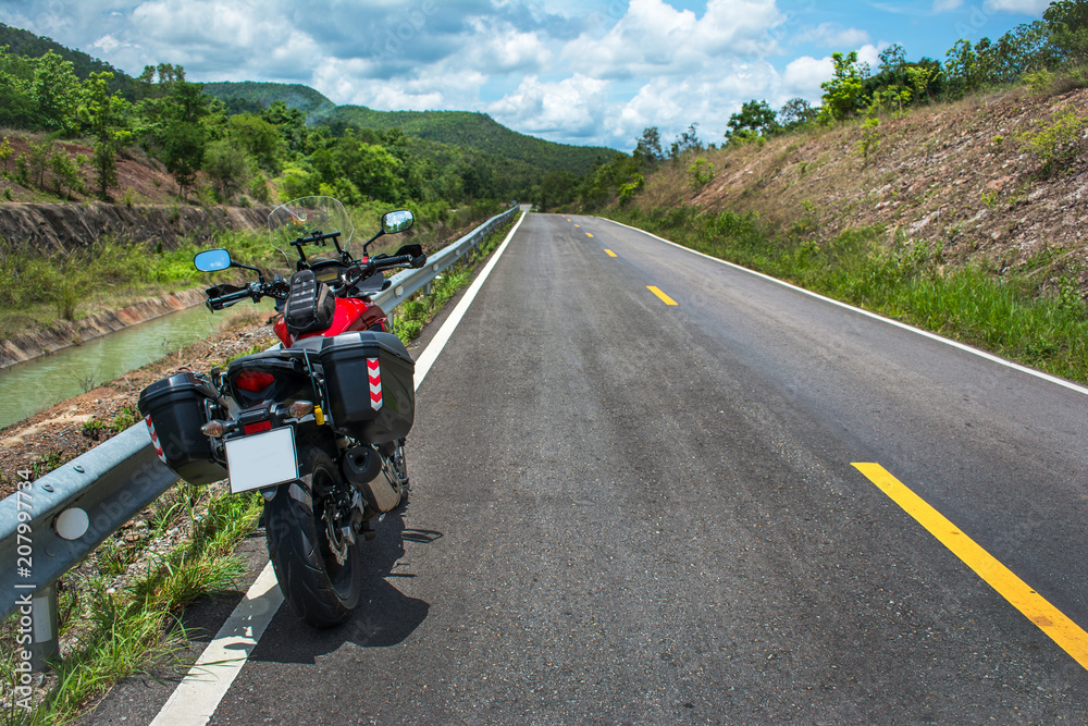 Traveling on a touring motorcycle on the mountain roads. Traveling on a touring motorcycle on the mountain roads.