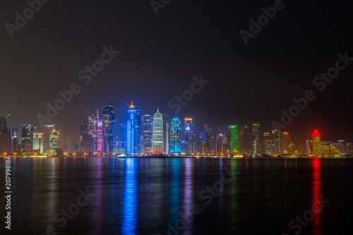 doha night city reflecting in water of persian gulf © snowgonzales