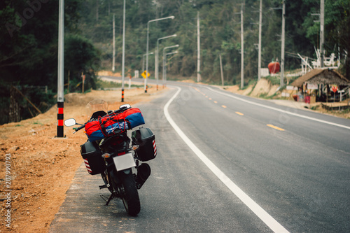 Riding a motorcycle on the road, Thailand.