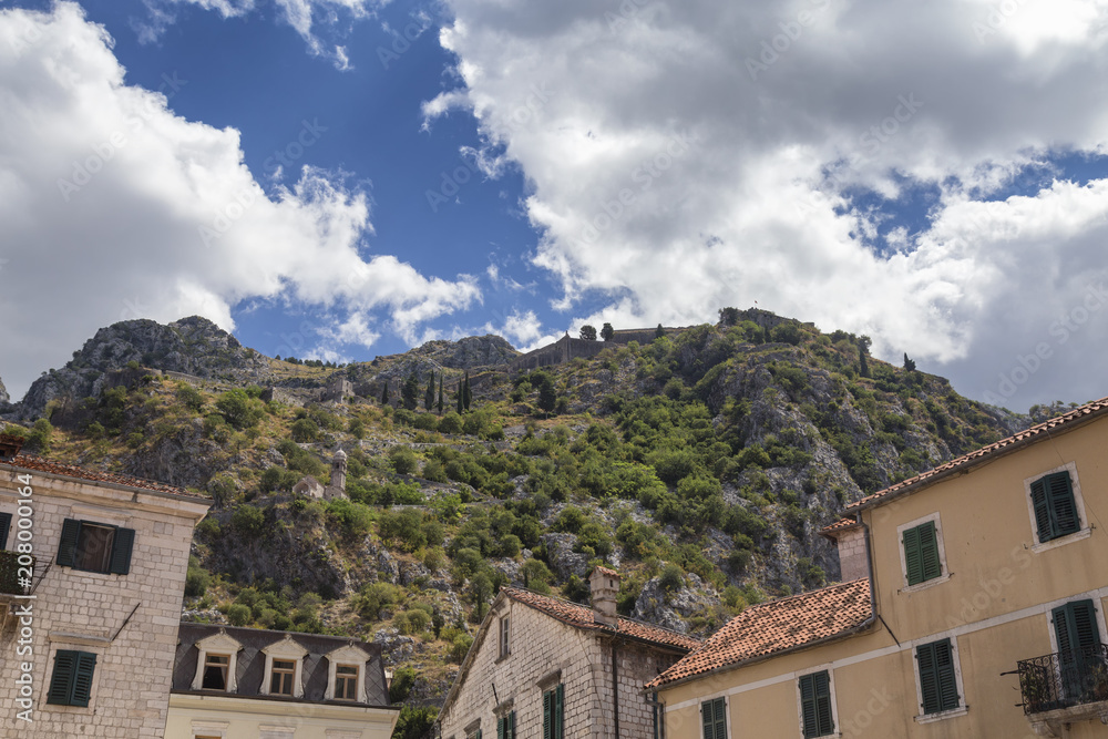 Naklejka premium Buildings and Mountain above Kotor, Montenegro.