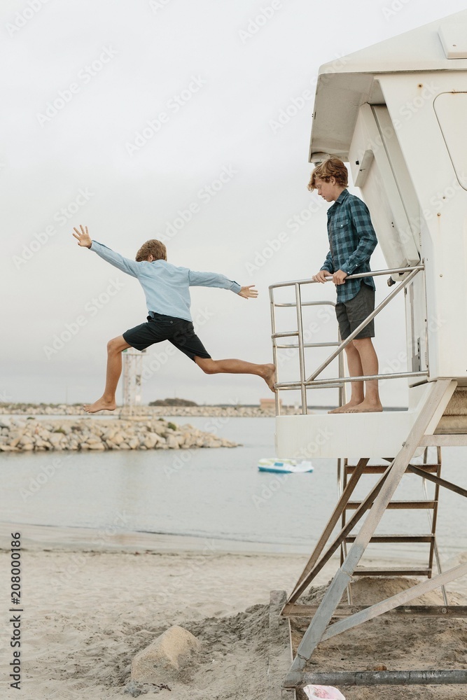 Brothers Jumping off a Lifeguard Tower Brothers Jumping off a Lifeguard Tower