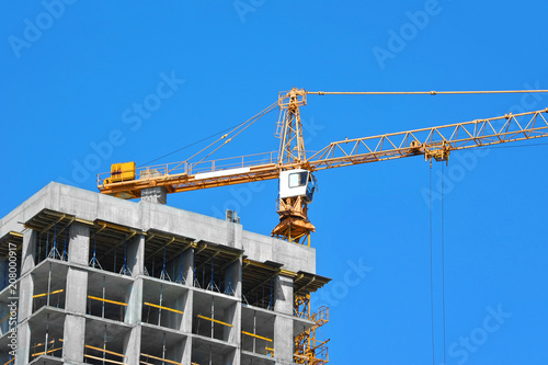 Crane and highrise construction site