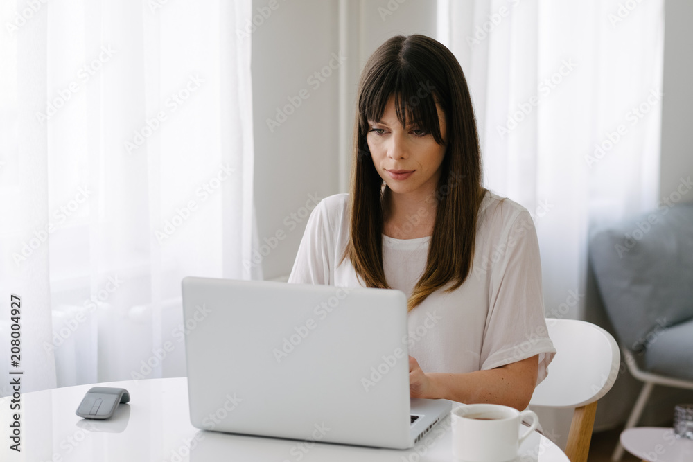 Portrait of a female model in her home office Portrait of a female model in her home office