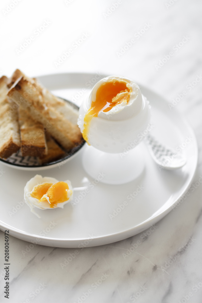 A soft-boiled egg with toast soldiers. A soft-boiled egg with toast soldiers.