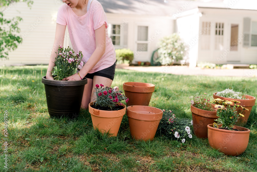teen potting plants & flowers on the lawn teen potting plants & flowers on the lawn
