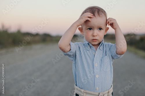 Adorable stylish boy outdoors photo