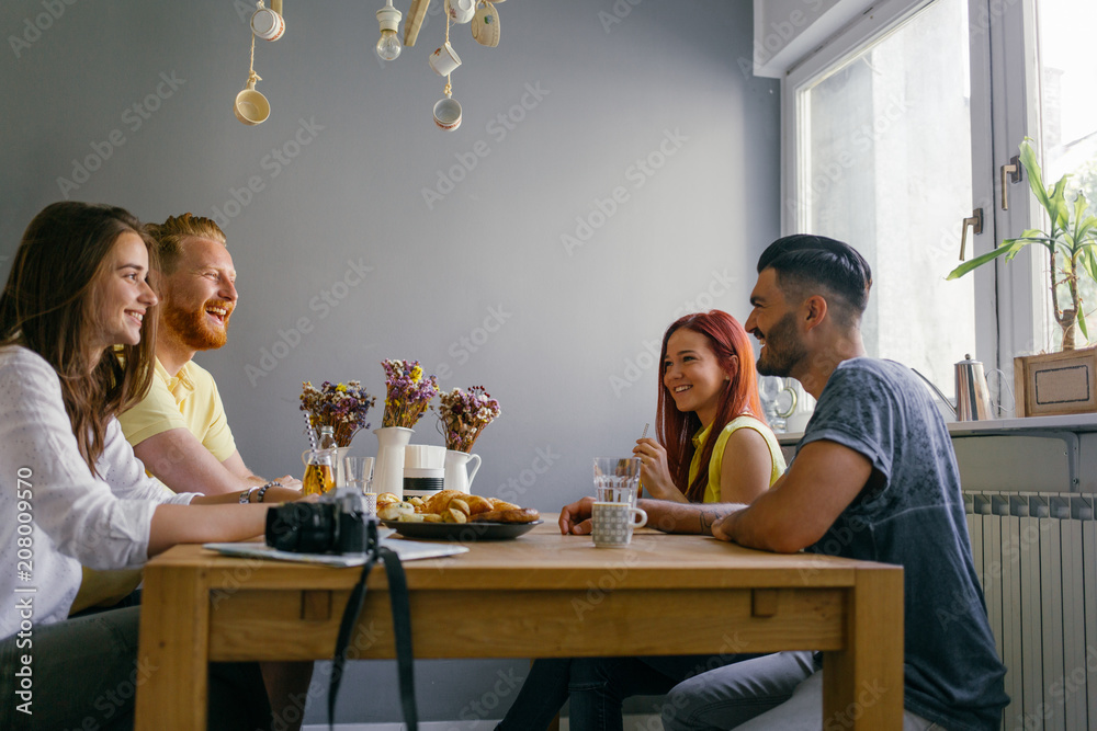 Friends Talking at the Table Friends Talking at the Table