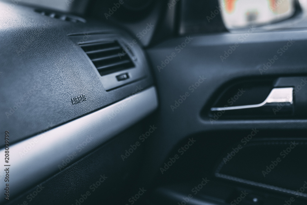 Passenger Side of a Car Featuring Dashboard Airbag Compartment