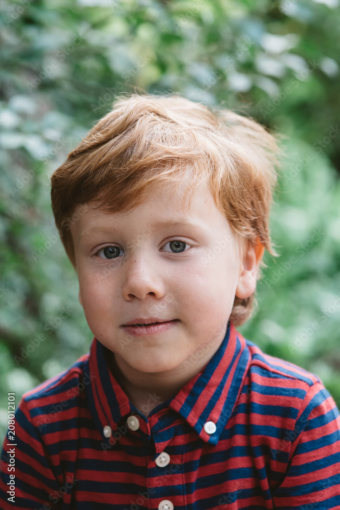 A four year old boy posing for portraits A four year old boy posing for portraits