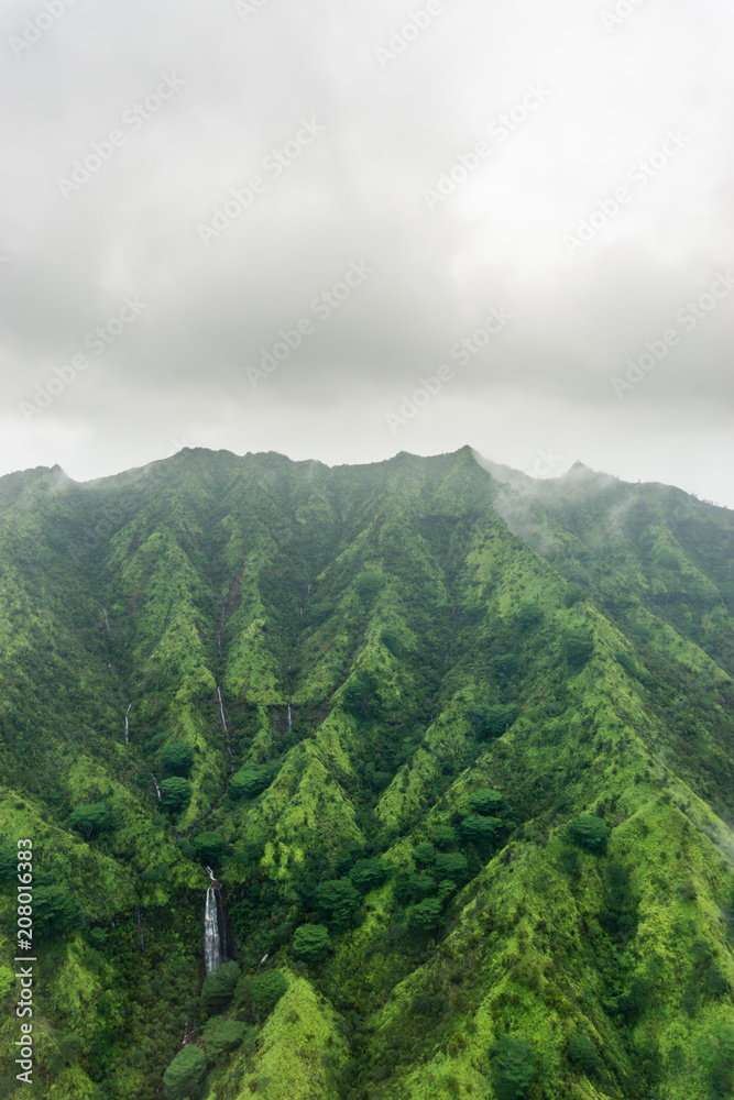 Aerial view on a overcast foggy day over Na Pali Coast in Kauai, Hawaii