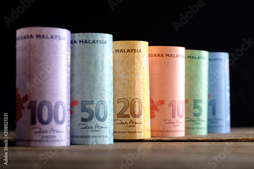 Row of Malaysia Ringgit on wooden table photo