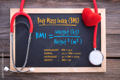 Body Mass Index formula on chalkboard, health concepts photo