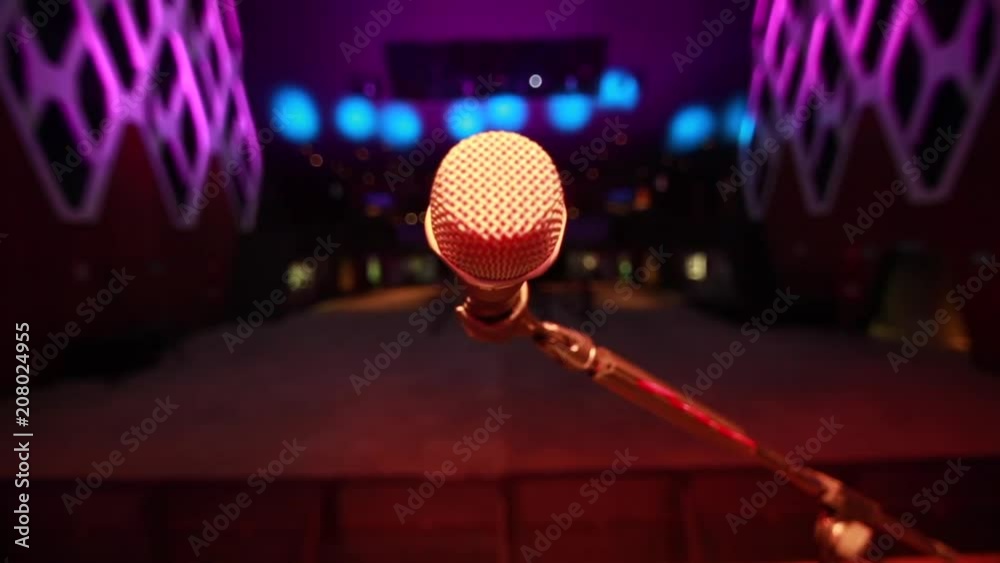 Close-up of a microphone on stage  at empty venue during sound check
