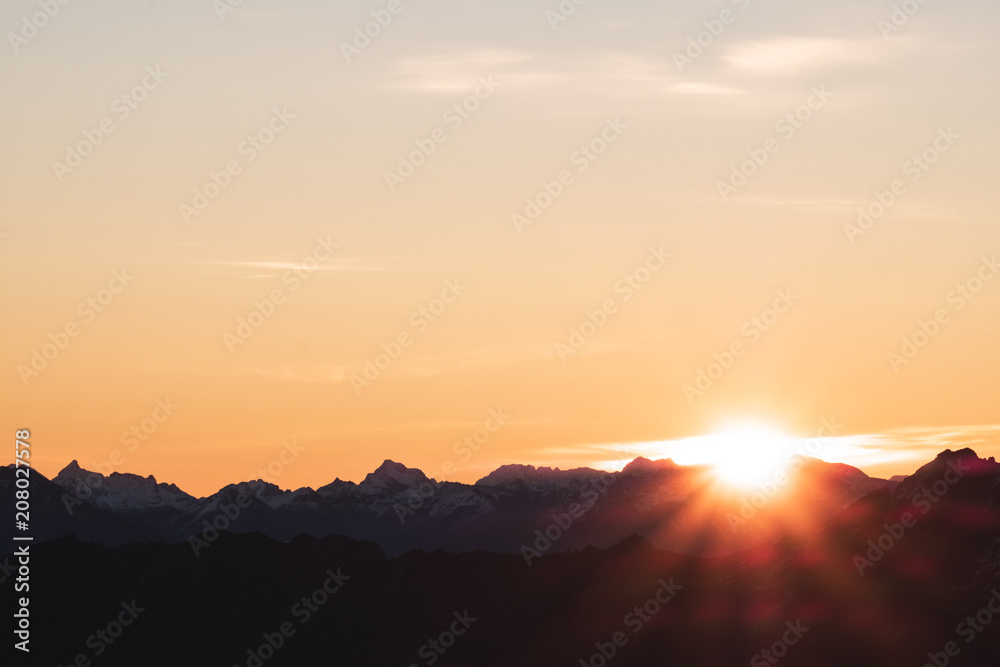 A stunning scene of sunset on the top of Alps mountain.