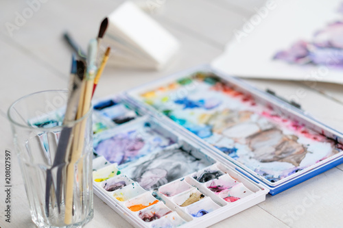 art painting leisure craft and hobby. drawing and creativity concept. watercolors and brushes on the desk