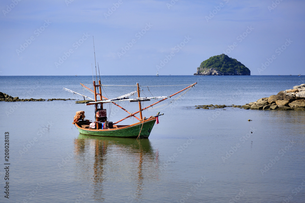 Beautiful beach with fishing boat at Prachuap Khiri Khan Province, Thailand Beautiful beach with fishing boat at Prachuap Khiri Khan Province, Thailand
