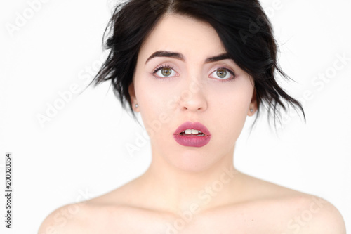 emotion face. speechless dumbstruck taken aback dazed woman young beautiful brunette girl portrait on white background.