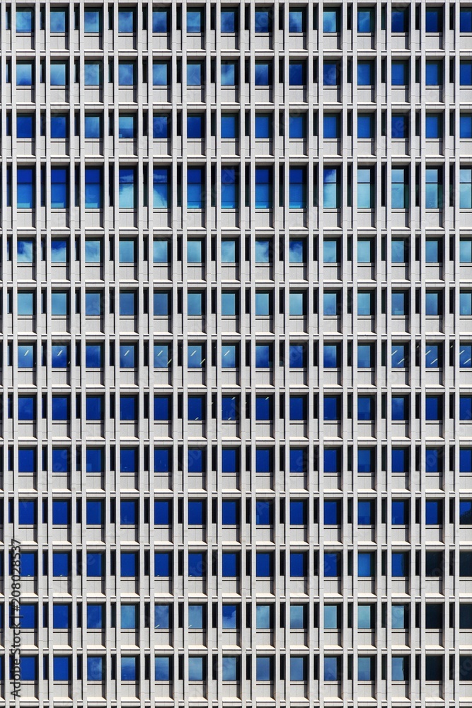 office building. steel frame and glass windows architecture. repeat rectangle pattern wall facade exterior of coporate building in Tokyo. office building. steel frame and glass windows architecture. repeat rectangle pattern wall facade exterior of coporate building in Tokyo.