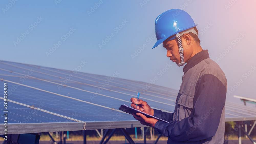 engineer working on checking and maintenance structure and solar panel and find problem to operate at green energy solar power plant engineer working on checking and maintenance structure and solar panel and find problem to operate at green energy solar power plant