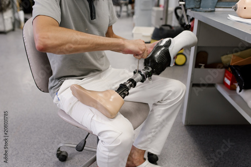 Crop man manufacturing new prosthesis photo