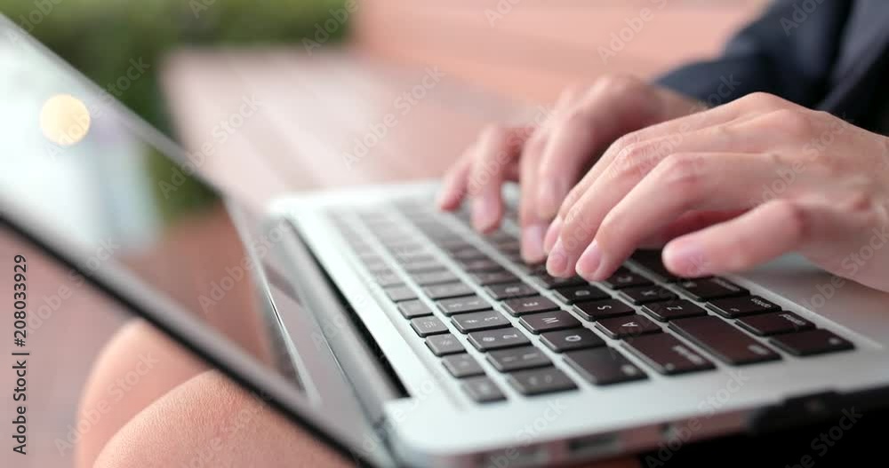Close up of typing on notebook computer Close up of typing on notebook computer