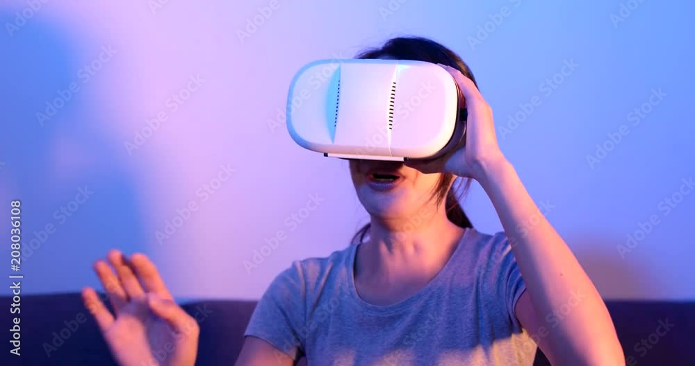 Woman play with virtual reality device Woman play with virtual reality device