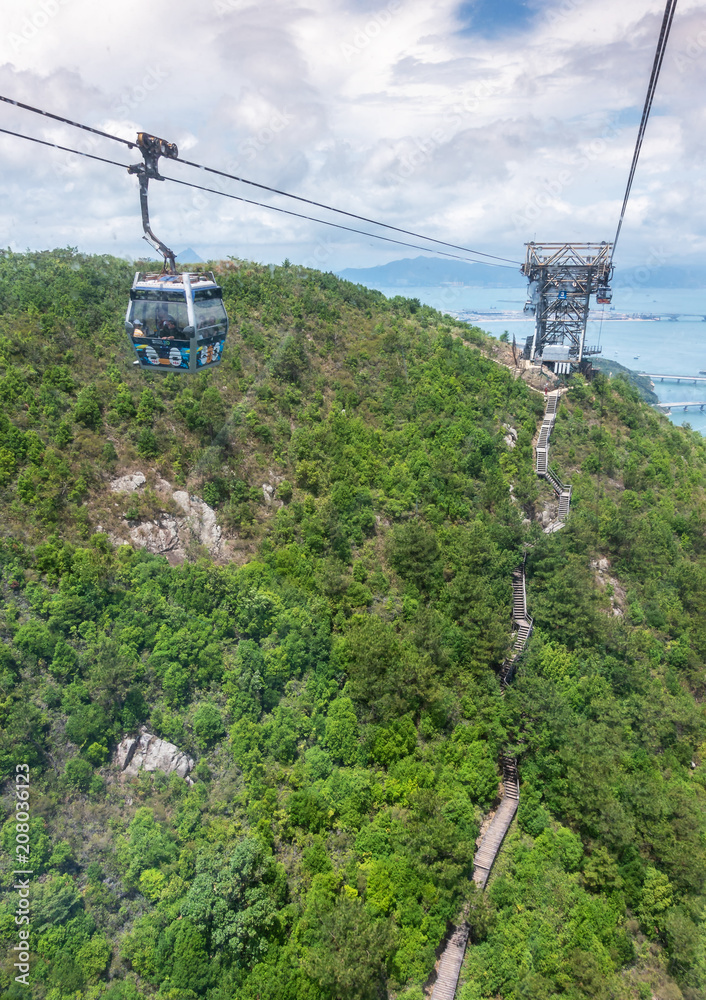 HONG KONG - MAY 5: Ngong Ping Cable Car on Lantau island of Hong Kong. Long distance cable car across the mountain in Hong Kong, Ngong Ping cable car.