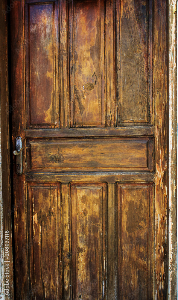 The old door. Texture of an old board. Background. The old door. Texture of an old board. Background.