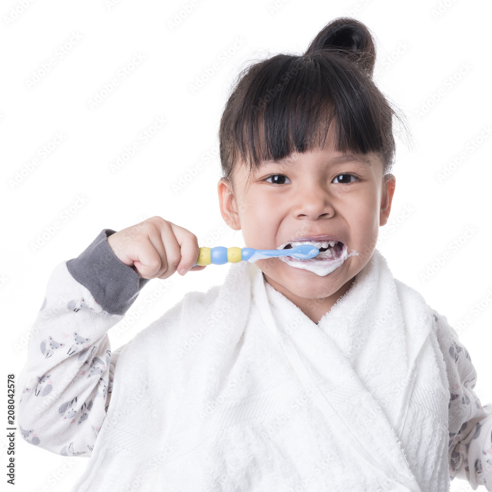 Little girl brushing her teeth isolated on white background Little girl brushing her teeth isolated on white background