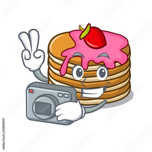 Photographer pancake with strawberry mascot cartoon