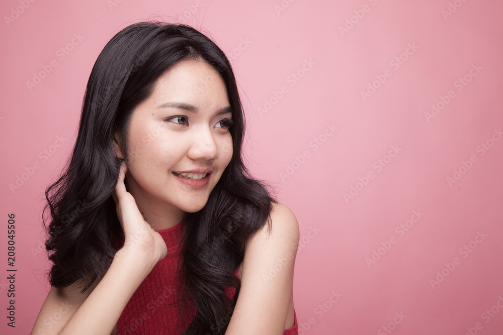 Portrait of beautiful young Asian woman in red shirt Portrait of beautiful young Asian woman in red shirt