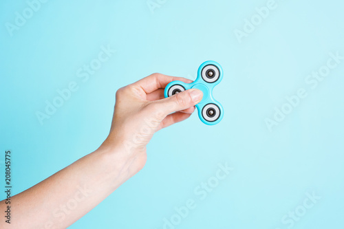 Hand holding a Fidget spinner