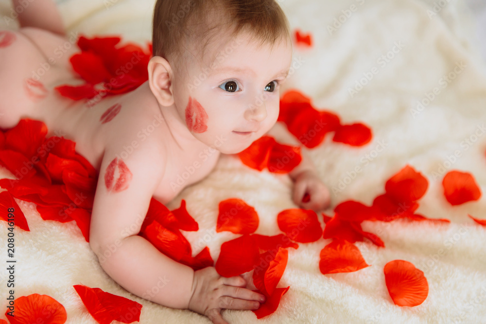 close-up kissed lips red lipstick the child lies on the bed. A little girl who is fond of parents. Stock Photo | Adobe Stock
