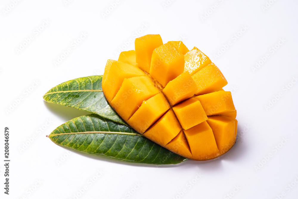 Fresh and beautiful sliced diced mango chunks and leaves isolated with white background,   copy space(text space), blank for text