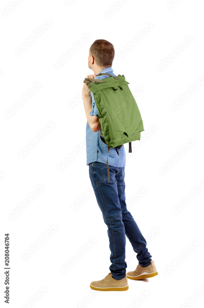 Back view of a man with a green bag. Back view of a man with a green bag.