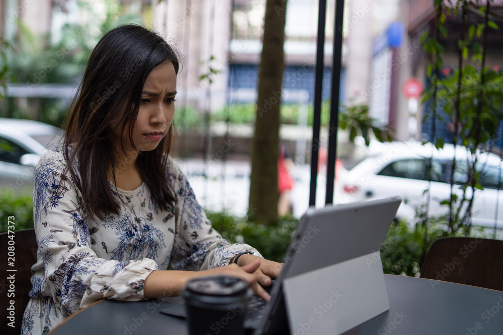 a chinese girl using a laptop a chinese girl using a laptop