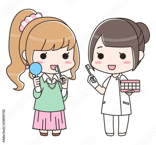 女性に歯磨き指導をする歯科衛生士の女性（全身）