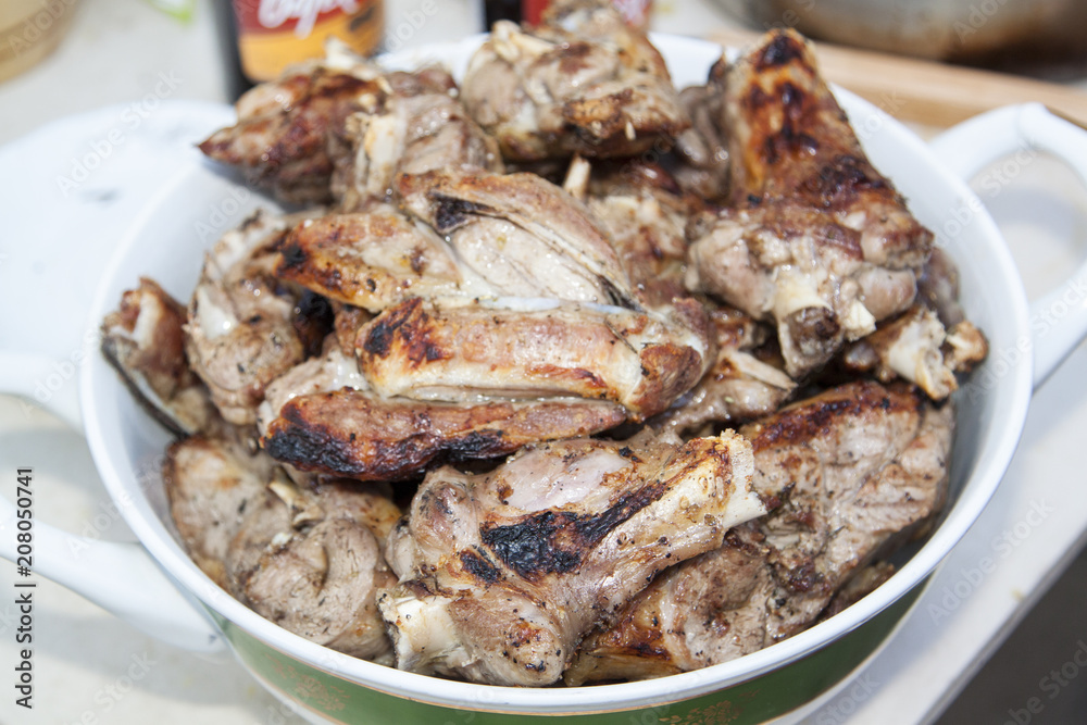 close-up of tasty cooked juicy pieces of lamb lying in the dish close-up of tasty cooked juicy pieces of lamb lying in the dish