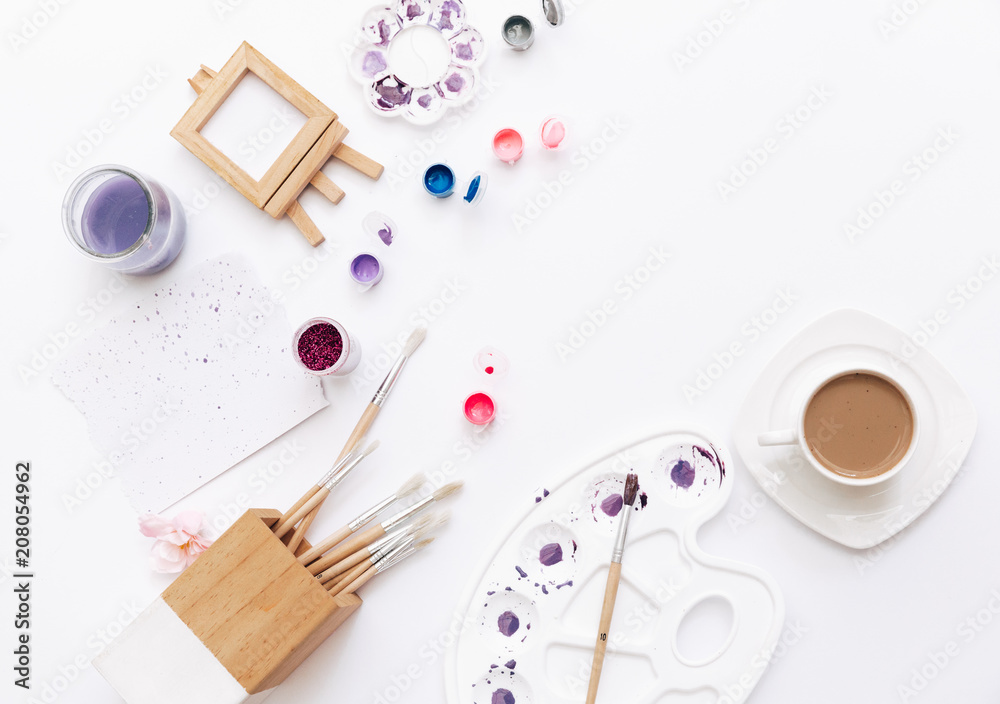 Art workspace for designer and artists. Flat lay with brushes and paint. Minimal concept Art workspace for designer and artists. Flat lay with brushes and paint. Minimal concept