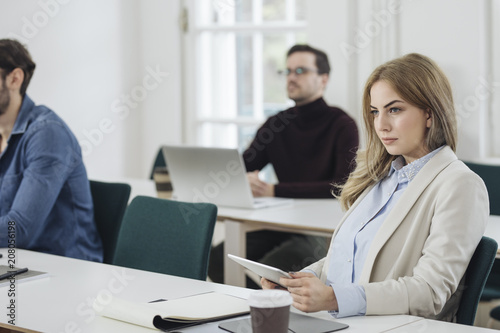 Young Businesswoman Sitting in Office