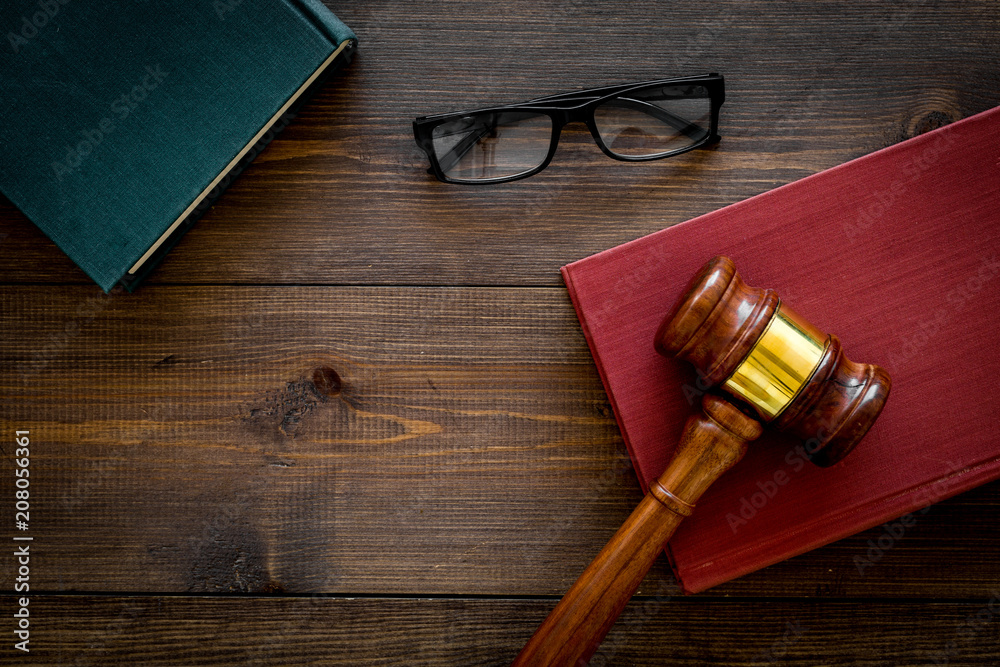 Law student concept. Judge gavel and vintage books on dark wooden background top view copy space
