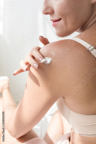 A Woman Using Skin Care Creme