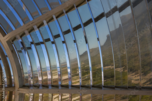 Unusual view from the inside of the Fresnel lens of the Slangkop lighthouse in South Africa