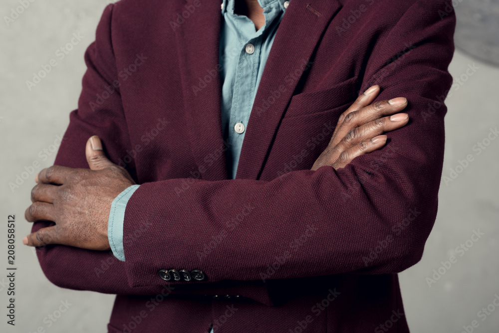 cropped view of stylish african american man with crossed arms in burgundy jacket
