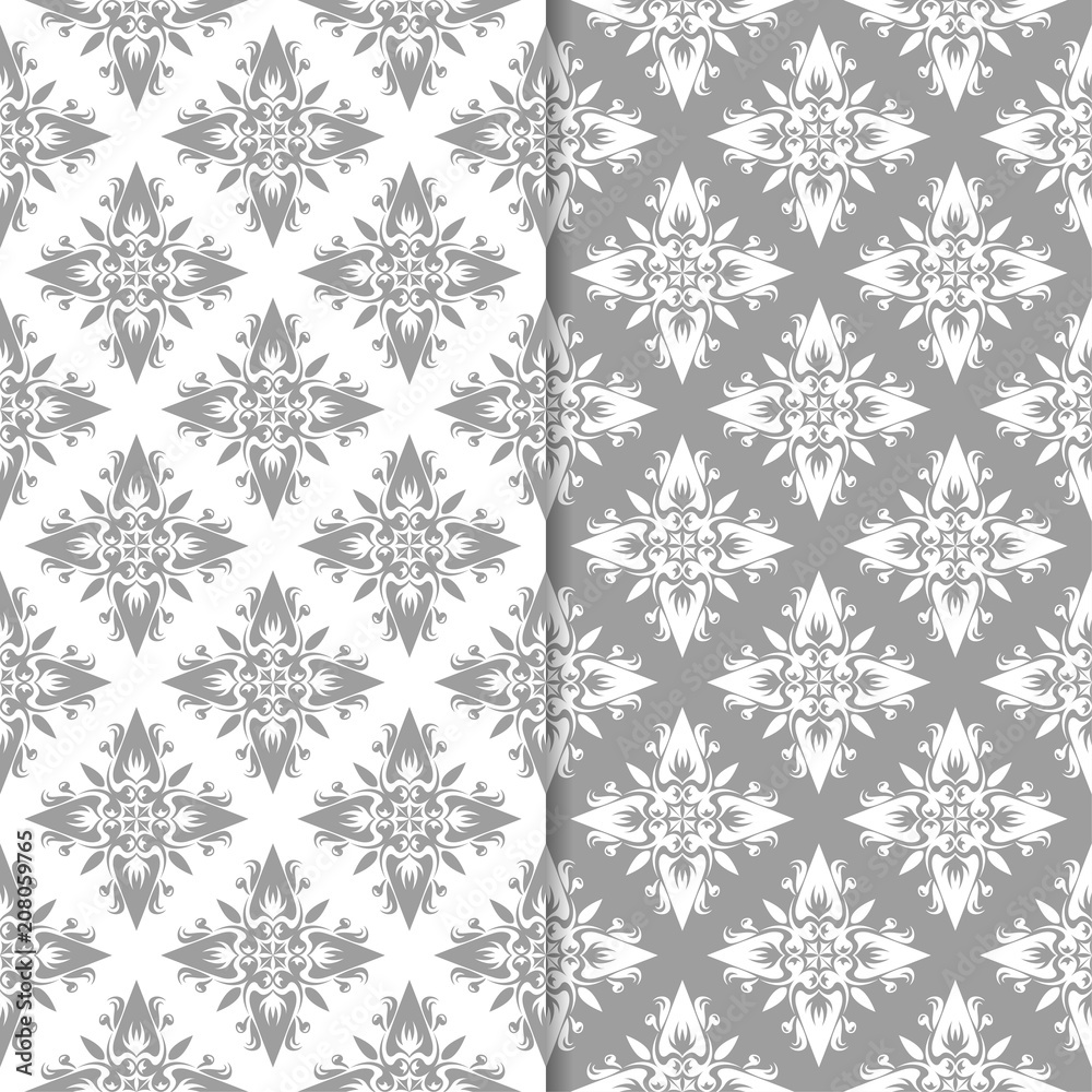 White and gray floral ornaments. Set of seamless backgrounds White and gray floral ornaments. Set of seamless backgrounds