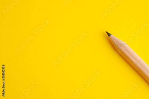 Pencil on yellow background