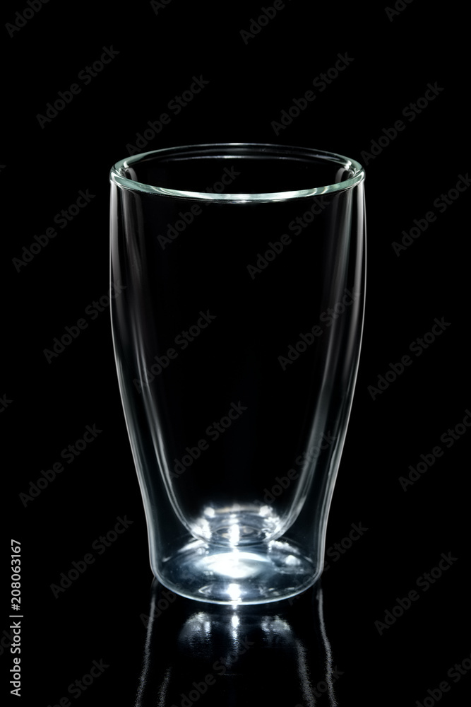 Empty double walled coffee glass isolated on black Empty double walled coffee glass isolated on black
